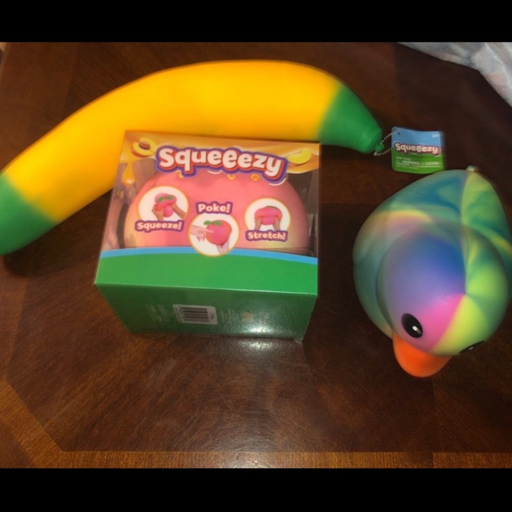 Target Sunny days sqeeezy banana peach duck squishy